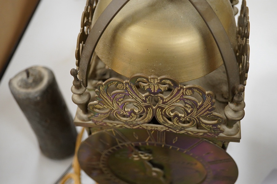 After Thomas Moore of Ipswich, a brass cased lantern clock with a weight driven pendulum movement with anchor escapement, 36cm high. Condition - fair.